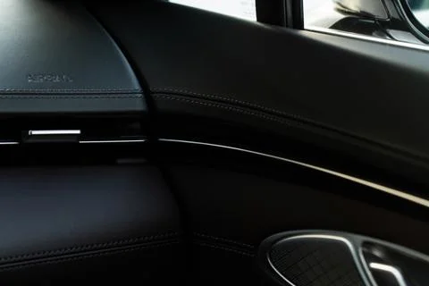 Modern car interior close up view with metallic and plastic details. Interior Stock Photos