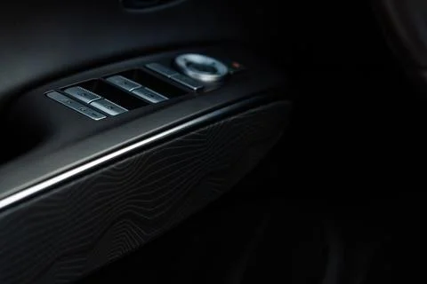 Modern car interior close up view with metallic and plastic details. Interior Stock Photos
