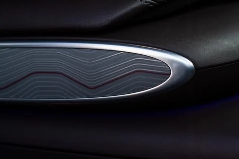 Modern car interior close up view with metallic and plastic details. Interior Stock Photos