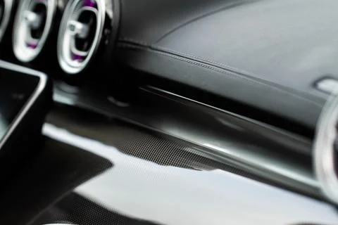 Modern car interior close up view with metallic and plastic details. Interior Stock Photos
