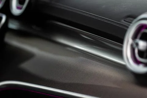Modern car interior close up view with metallic and plastic details. Interior Stock Photos