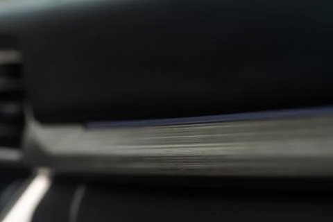 Modern car interior close up view with metallic and plastic details. Interior Stock Photos