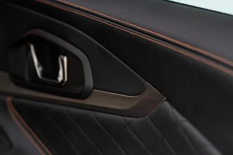 Modern car interior close up view with metallic and plastic details. Interior Stock Photos