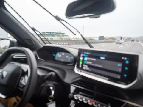 Modern car interior with digital dashboard on highway drive 스톡 사진