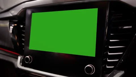 Modern car interior with digital infotainment display green screen mockup. Stock Photos