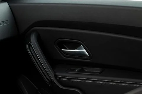 Modern car interior door panel. Car detailing. Stock Photos
