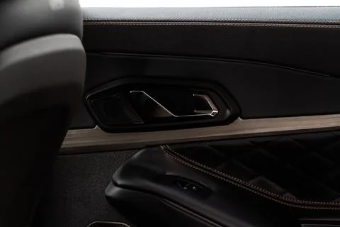 Modern car interior door panel. Car detailing. Stock Photos