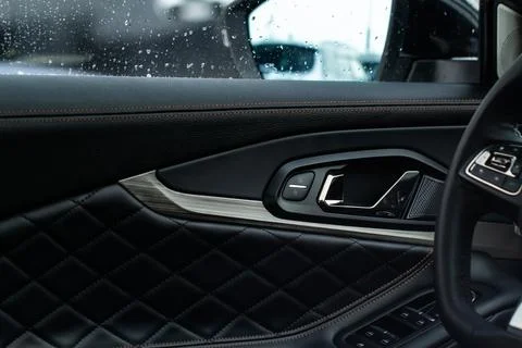 Modern car interior door panel. Car detailing. Stock Photos