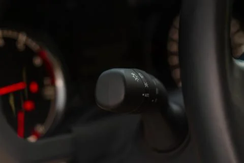 Modern car light switch. Turning on headlight in the car. Close up of car lig Stock Photos