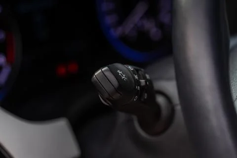 Modern car light switch. Turning on headlight in the car. Close up of car lig Stock Photos