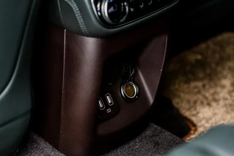 Modern car outlet socket. Closed 12V power outlet socket and opened USB port. Stock Photos