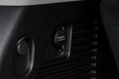 Modern car outlet socket. Closed 12V power outlet socket. Stock Photos