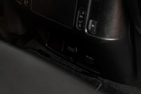 Modern car outlet socket. Closed 12V power outlet socket and opened USB port. Stock Photos