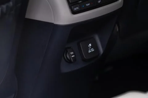 Modern car outlet socket. Closed 12V power outlet socket and 220v power outle Stock Photos