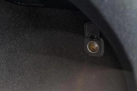 Modern car outlet socket. Opened 12V power outlet socket. Stock Photos