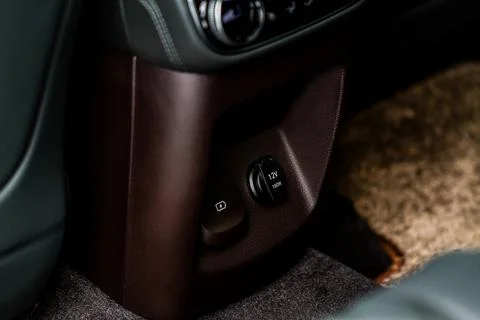Modern car outlet socket. Opened 12V power outlet socket and closed USB port. Stock Photos