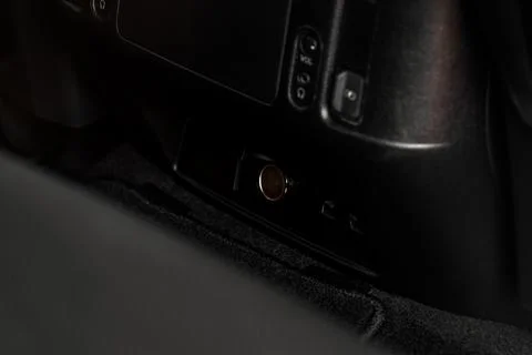 Modern car outlet socket. Opened 12V power outlet socket and closed USB port. Stock Photos
