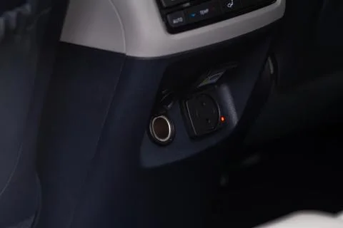 Modern car outlet socket. Opened 12V power outlet socket and 220v power outle Stock Photos