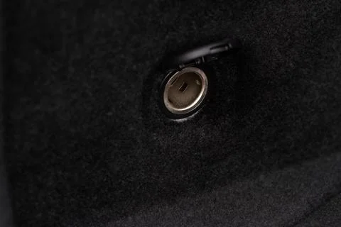 Modern car outlet socket. Opened 12V power outlet socket. Stock Photos