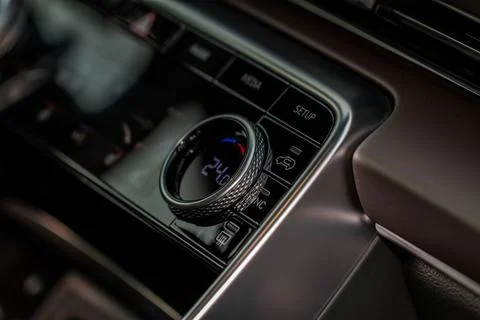 Modern car passengers temperature control. Car air conditioning system button Foto stock