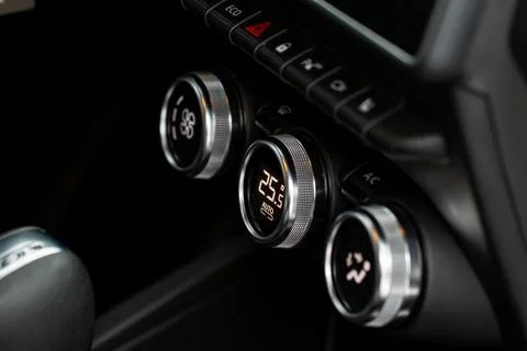 Modern car passengers temperature control. Car air conditioning system button Stock Photos