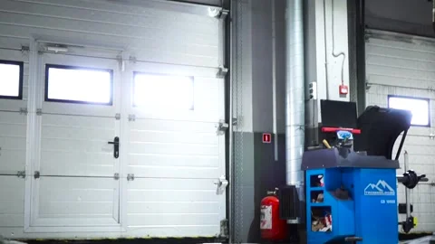 Modern car service inside with machine hydraulic lifts, machine tools and 動画素材 139347980