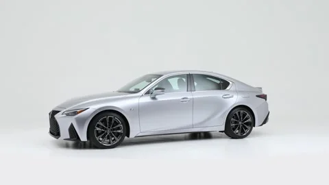 Modern car in studio rotation shot Solid Red 2021 Lexus IS IS 350 F Sport sedan Stock Footage 159369484