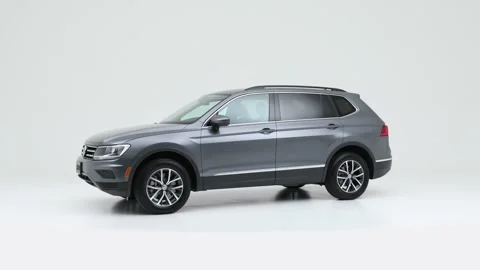 Modern car in studio rotation shot Blue Crush Metallic 2020 Volkswagen Tiguan SE Video stock 159376796