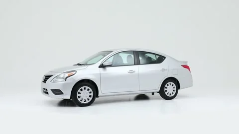 Modern car in studio rotation shot Cement 2019 Nissan Versa SV Stock Footage 159380381