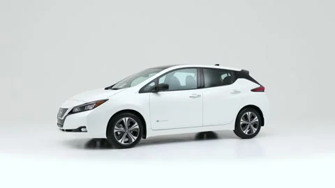 Modern car in studio rotation shot Daytona Gray Pearl Effect 2018 Nissan LEAF SL Stock Footage 159382502