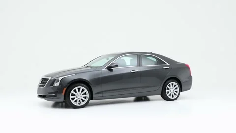 Modern car in studio rotation shot Flamenco Red Metallic 2018 Cadillac ATS SE Stock Footage 159383963