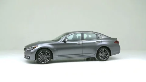 Modern car in studio rotation shot Graphite Gray Metallic 2017 Infiniti Q70 3.7 Stock Footage 159385377