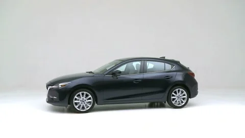 Modern car in studio rotation shot Gun Metallic 2017 Mazda MAZDA3 Grand Touring Stock Footage 159385931
