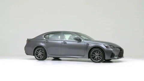 Modern car in studio rotation shot Magnetic Black Metallic 2016 Lexus GS F Stock Footage 159524072