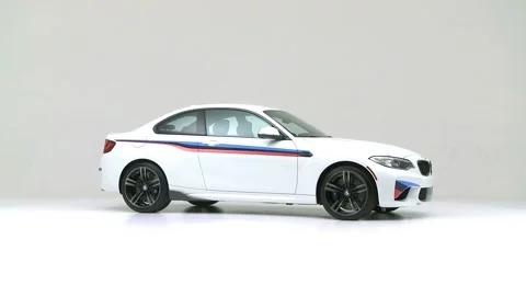 Modern car in studio rotation shot Oxford White 2017 BMW 2-series M2 Stock Footage 159531916