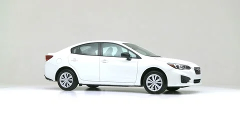 Modern car in studio rotation shot Pure White 2017 Subaru Impreza 2.0i Stock Footage 159533170