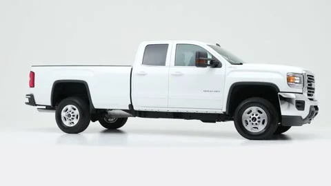 Modern car in studio rotation shot Summit White 2019 GMC Sierra 2500HD SLE Stock Footage 159535320