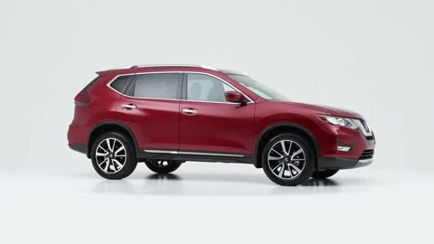Modern car in studio rotation shot Sunset Orange Metallic 2020 Nissan Rogue SL Stock Footage 159535563