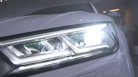 Modern car, view of car headlight, diode lamp glow, motion. Stock-Footage 84975843