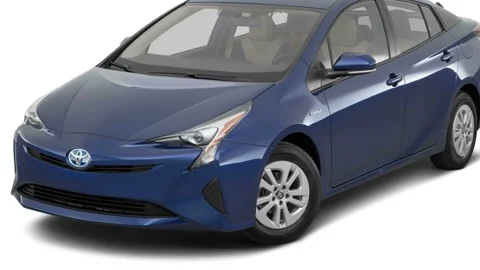 Modern car in white studio front view Blue Crush Metallic 2016 Toyota Prius Two Video stock 159869729