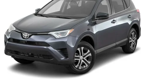 Modern car in white studio front view Magnetic Gray Metallic 2016 Toyota RAV4 LE Stock Footage 159870320