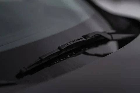 Modern car windscreen wiper. Windshield wiper. Closeup of car windshield wipe Stock Photos