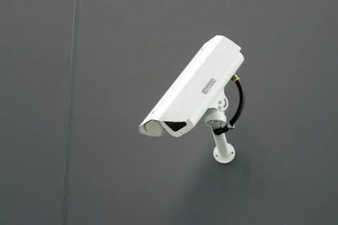Modern cctv camera attach to the wall. Concept of surveillance and monitoring Stock Photos