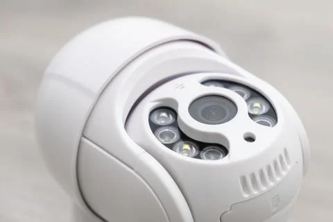 Modern CCTV camera is ready for installation on the table Stock Photos