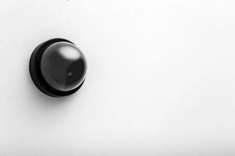 Modern CCTV security camera on white wall. Space for text Stock Photos