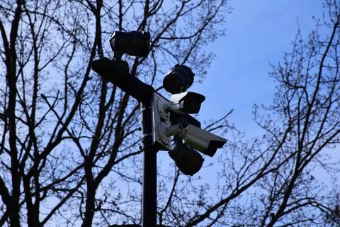 Modern CCTV security cameras on a pole contrasting 스톡 사진