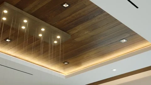 Modern ceiling design featuring wooden panels and recessed lighting. Ceiling has Stock-Footage 295551725