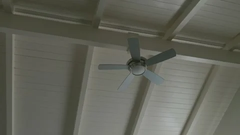 Modern Ceiling Fan Mounted on White Beamed Ceiling 스톡 동영상 341832831