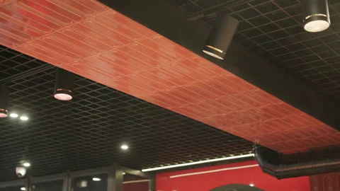 Modern ceiling featuring grid patterns, recessed lighting, pendant lamps Stock Footage 297585885