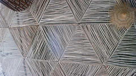 Modern ceiling with geometric pattern of thin gray wooden strips Stock Photos